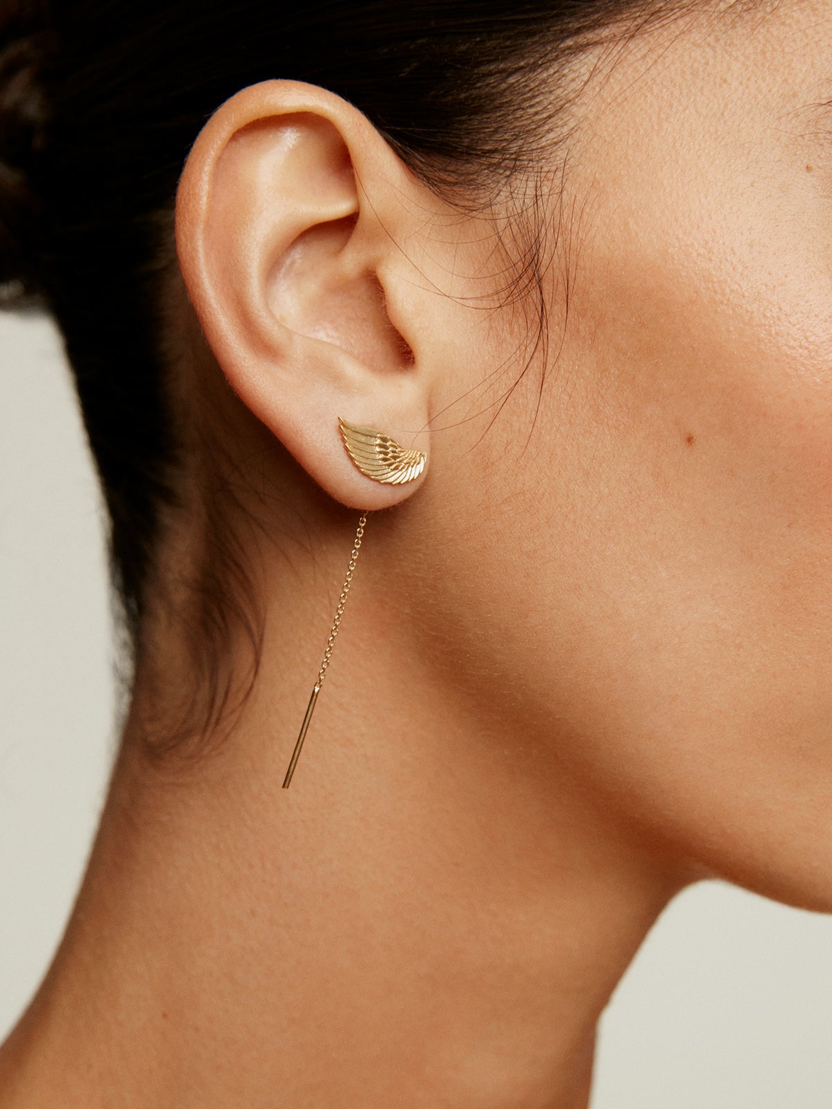 Long 925 silver earrings bathed in 18K yellow gold with wings